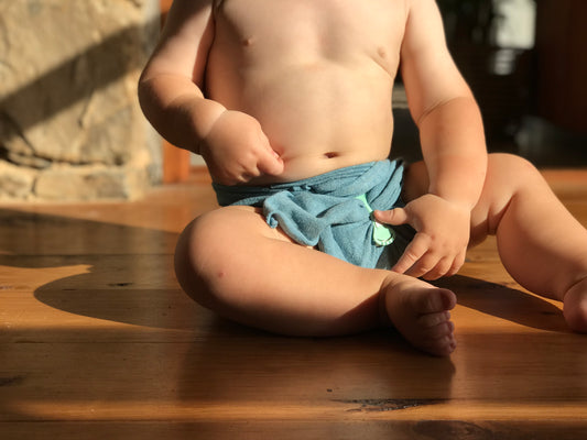 Cute baby in modern Pokkelokkie cloth nappy